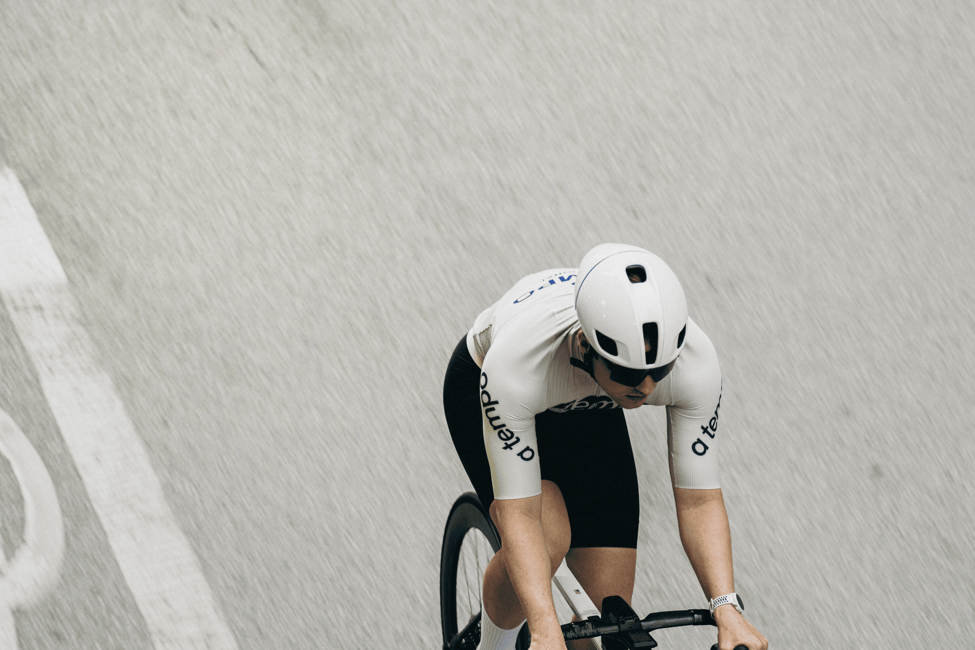 Cyclist wearing A Tempo jersey from a rear view